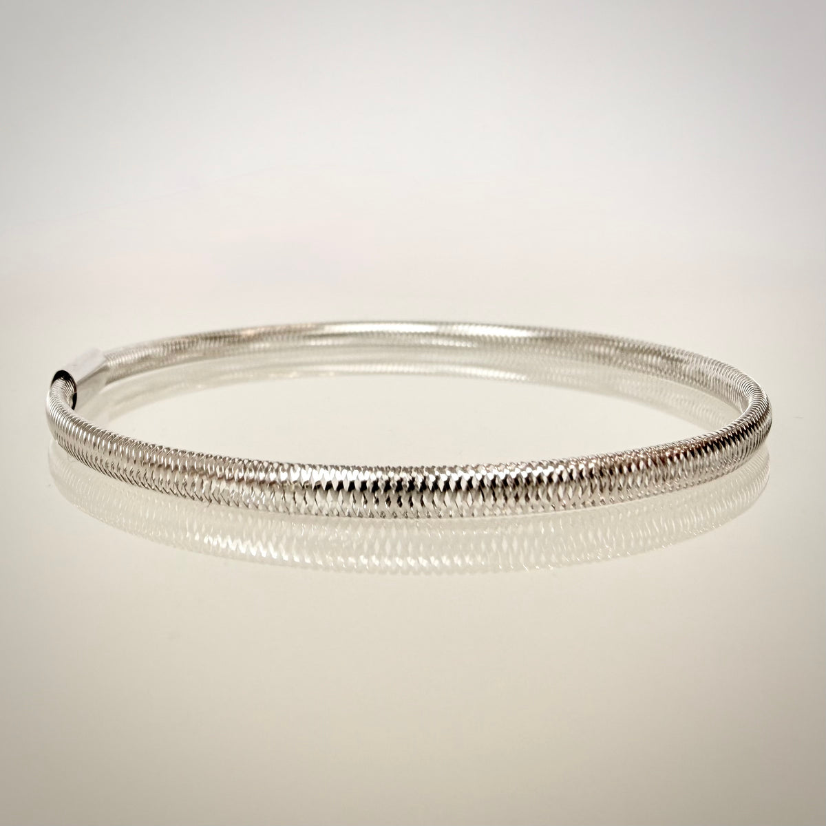 18K valkokultainen joustava mesh-rannekoru – Made in Italy sivulta